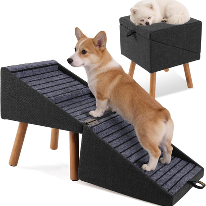 Tan Corgi climbing black fabric foldable dog stairs with white Spitz resting on matching elevated black pet bed with wooden legs.