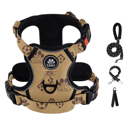 Tan and black no-pull dog harness with paw print pattern, includes black leash, collar strap, and waste bag dispenser.