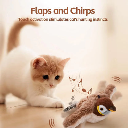 Cream and white cat watching brown plush flapping bird toy with feathers and motion lines on wooden floor.