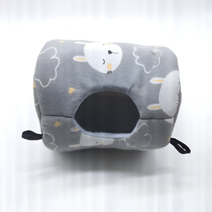 Gray fabric hammock bed with cloud and moon pattern, black entrance hole, and hanging straps for small pets.